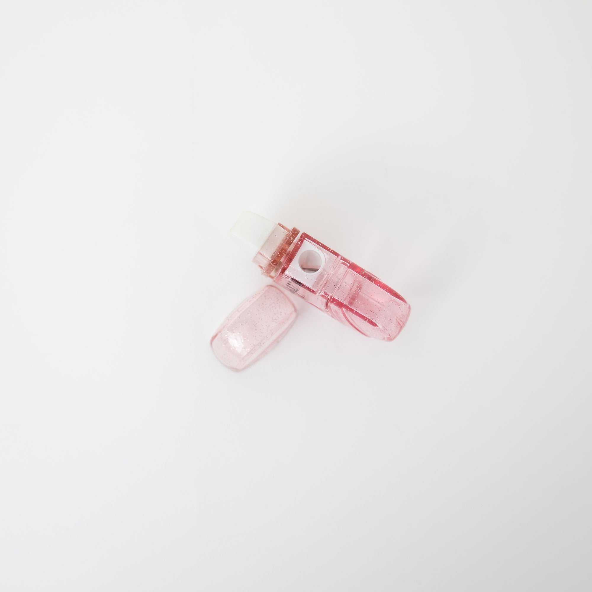 Gomme à paillettes rose avec réservoir